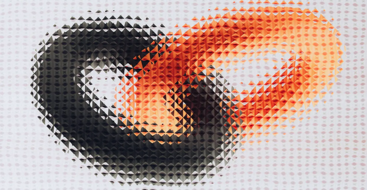 Woven black and orange pattern forming a looped knot shape
